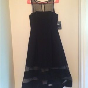The dress is by designer Aiden Mattox. NWT